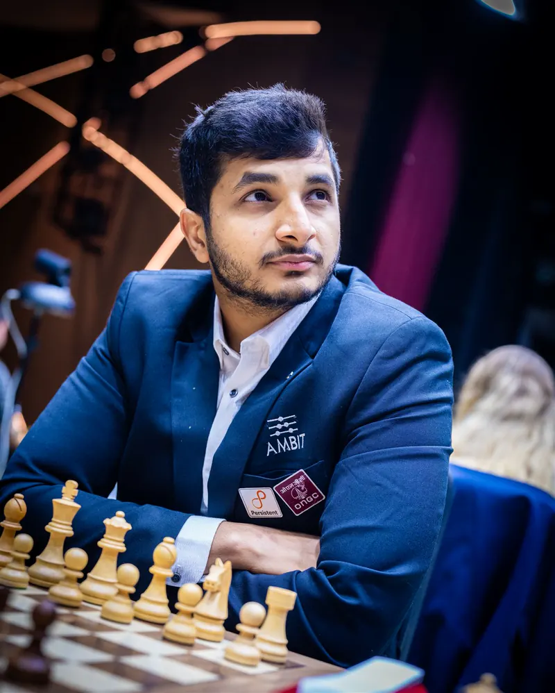 Vidit Gujrathi at the board, arms crossed